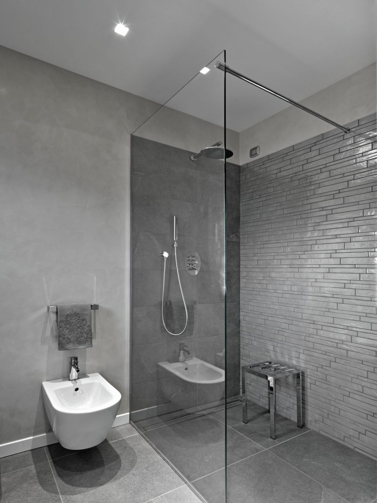 modern bathroom interior with glass shower box bidet foregorund scaled e1690974350916